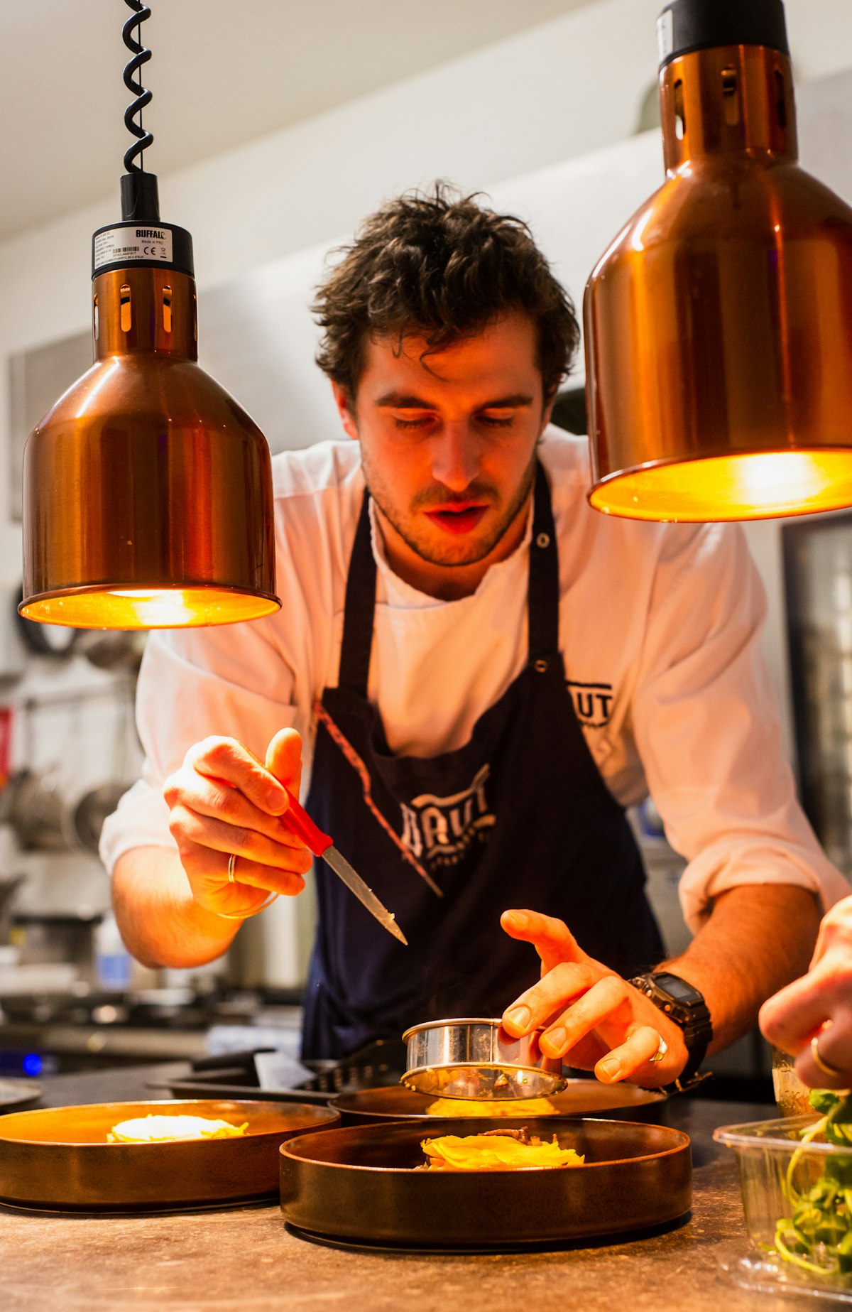 Chef at work over a flame